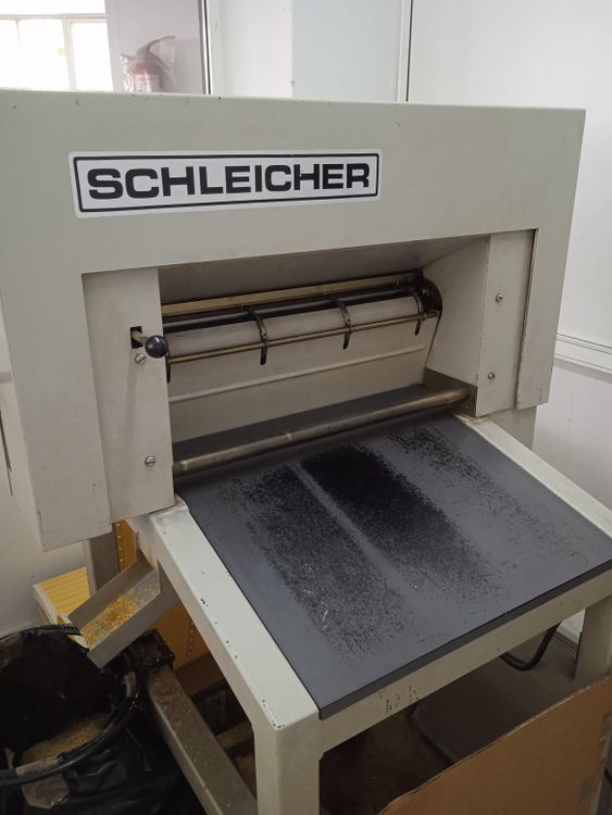 Schleicher Jacquard card punching machine for transferring the digital design on physical paper.