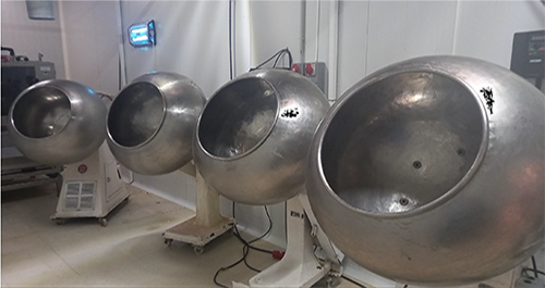 Four stainless steel coating pans