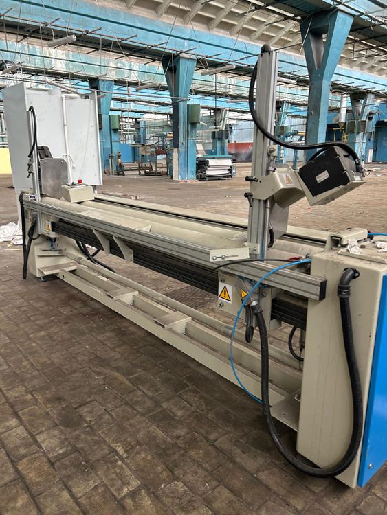 Comatex fabric roll wrapping machine
