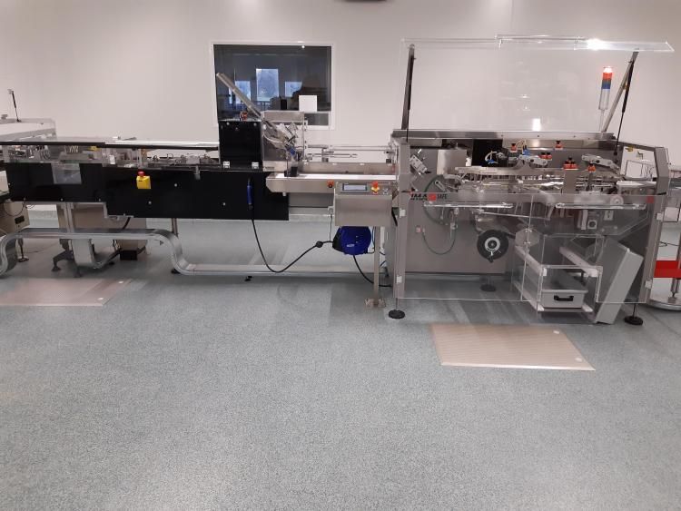 Horizontal intermittent cartoning machine