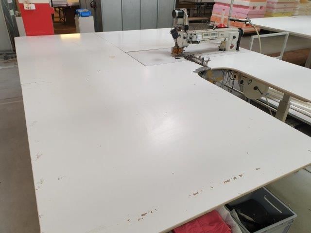 Machines for sewing zippers into mattress covers