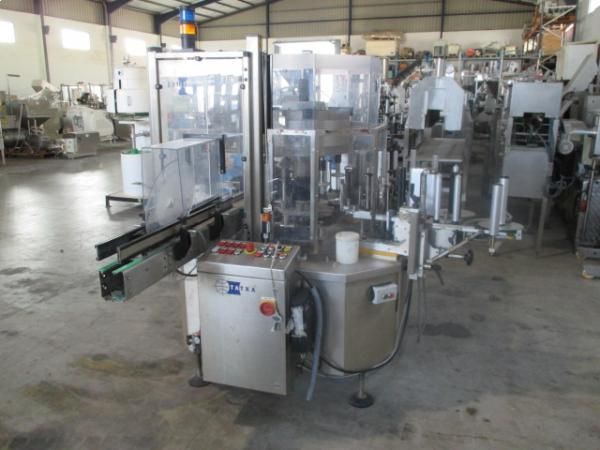 Tatxa  CG80/4+2 XPS Adhhesive rotary labeler .