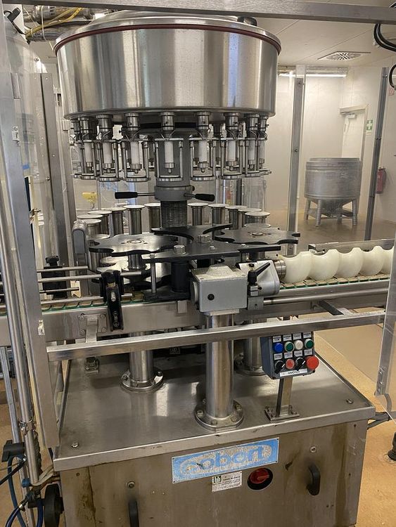 Filling and packaging system for vinegar/oil in plastic bottles