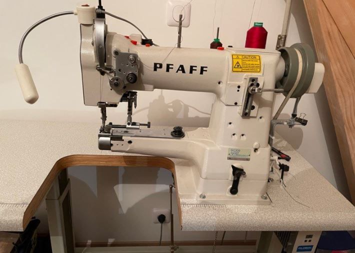 Vintage pfaff sewing machine in cabinet