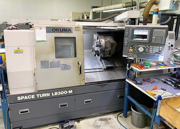 Okuma OSP E 100 L 3800min/-1 SpaceTurn LB 300 MC / 1000 3 Axis