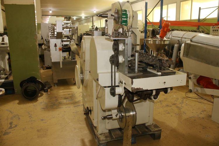 Latini C  die pop and wrapping machine