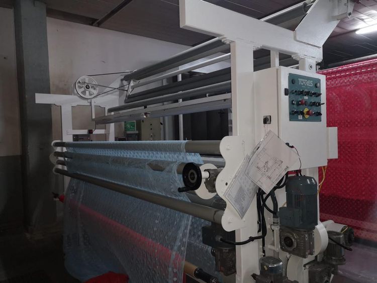 Torres Machine designed for warpwise floating opening