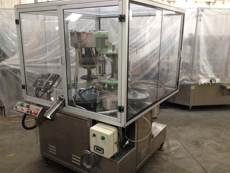 Filling and capping machine for microclimates contel