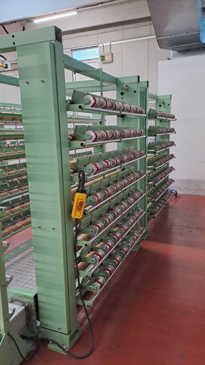 Muller Unroll creel for elastic yarns