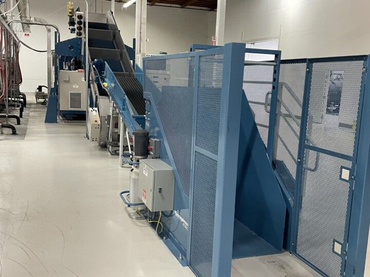 Kannegiesser Cart Dumper with Conveyor to Load Tunnel Washer