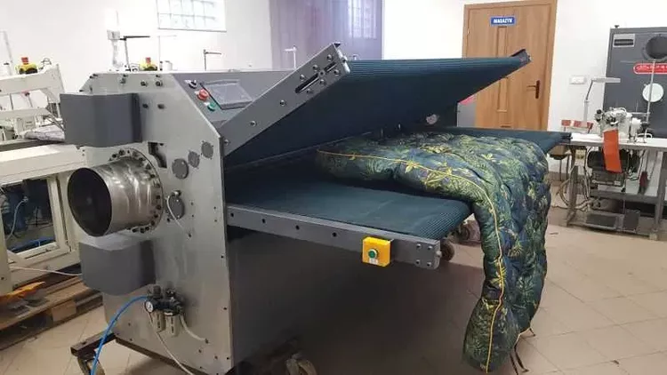 Rollpac sewing machine for rolling and packing mattresses