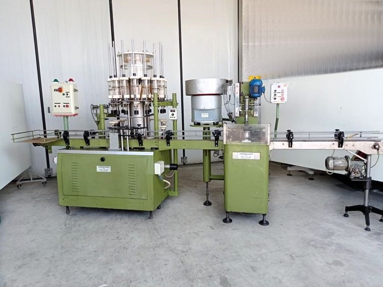 LIQUID FILLING AND CAPPING MACHINE