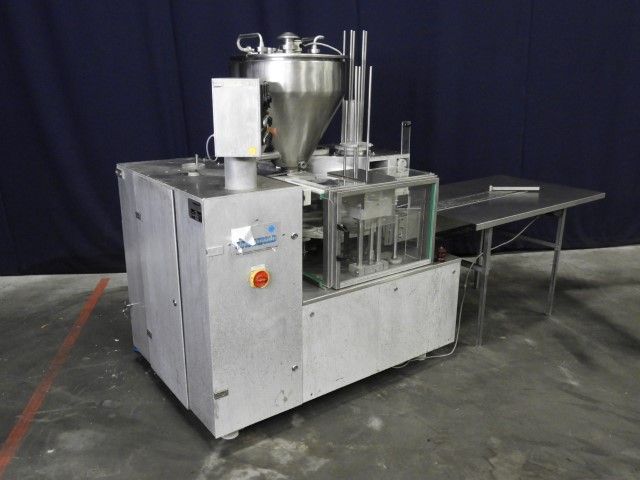 Grunwald Dosomat 2.1 Rotary cup filling and sealing machine