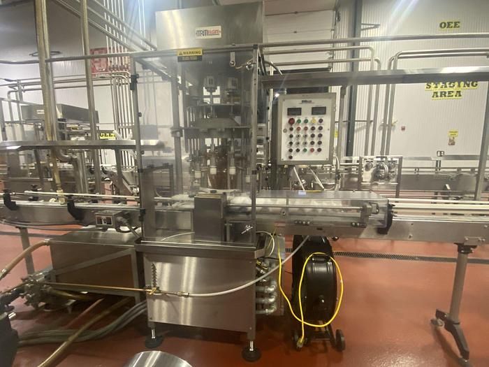 MRM Husky 12 head rotary pressure/gravity filler