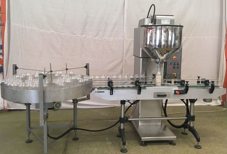 Weight or volumetric dosing machine
